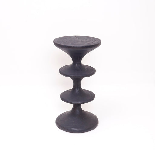 The Flint Side Table combines artisanal burned wood craftsmanship with a sleek, modern design. Durable and stylish, it enhances interiors while providing a practical surface for décor or essentials