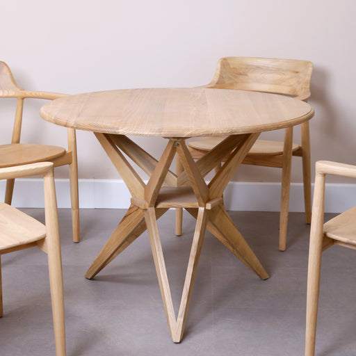 Introducing our Solid Wood Round Table—a centerpiece of classic elegance and enduring style. Crafted with precision from high-quality solid wood, this round table becomes the focal point of your dining area or gathering space. Whether hosting intimate dinners or lively conversations, this table is designed to stand the test of time, bringing warmth and sophistication to your home.Available in two colors, Natural and black.Dimensions - Diameter: 100cmHeight: 75cm