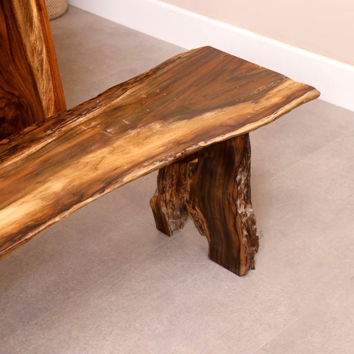 Transform your home with the exquisite craftsmanship and natural elegance of our Moreno. Handcrafted from Rose wood and designed to highlight the organic beauty of natural roots, this bench is a work of art that brings the tranquility of the forest to your home. 
NOTE : This price includes only the bench.