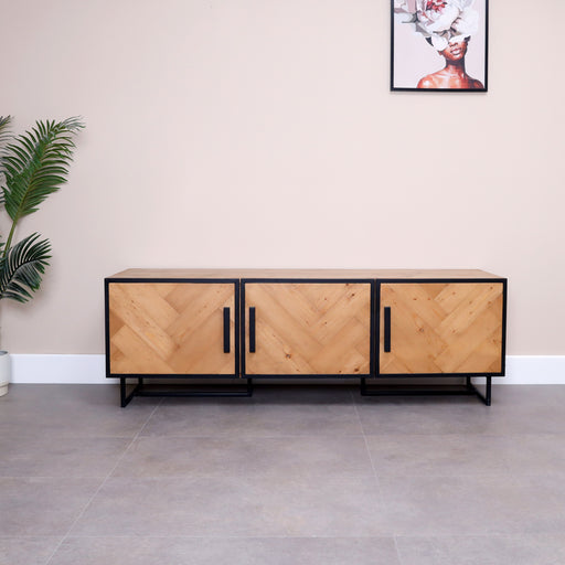 Crafted from solid wood and painted industrial legs, this bar console with herringbone pattern over the doors not only serves as a stylish addition to your home but also stands as a testament to durability and longevity.
Dimensions: Width180 x Depth50 x Height60 cm.