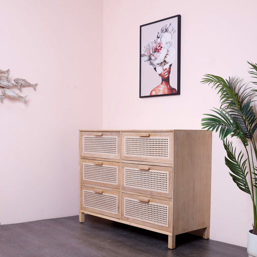 Crafted with teak wood in painted finish and woven rattan. A tribute to timeless allure.Drawers130x50x100ht
