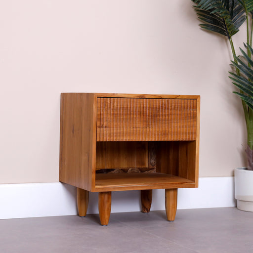 Made with Responsibly sourced Indonesian timber. This bedside table with solid wooden legs is stylish and provides plenty of storage space. 
Dimensions: Height:45cm, Length:50cm, Depth:45cm