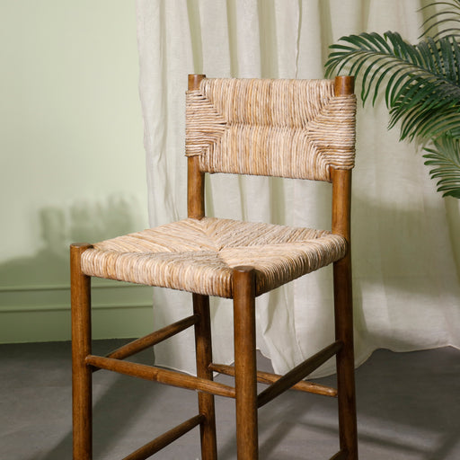 
Introducing the Urban Oak Falun Bar Chair – elevate your bar area with our stunning bar stool, meticulously crafted from solid wood and adorned with sea grass. Handcrafted with precision in Indonesia, this bar stool combines rustic charm with coastal elegance, making it a standout piece in any home. The solid wood construction ensures durability, while the sea grass detailing adds a touch of natural beauty. With a comfortable seating area and supportive backrest, this bar stool provides both style and comfort for your guests. 
Dimensions (Bar Chair) -Seating height : 75cm