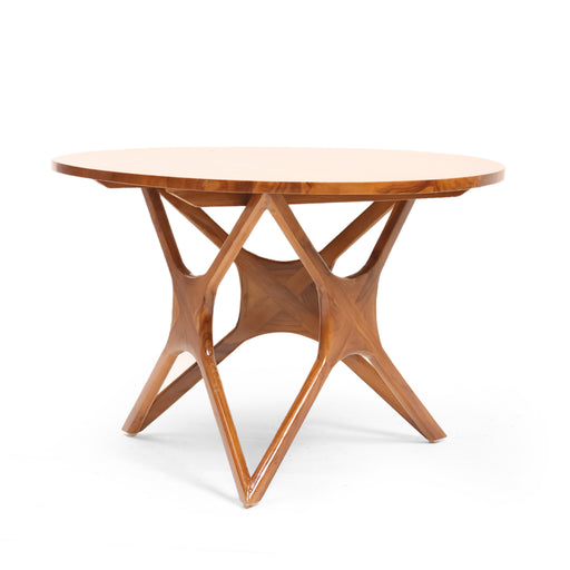 The Orion Coffee Table is a masterclass in modern structural design. The centerpiece of this table is its extraordinary hand-carved base, featuring a complex intersection of angular pillars that create a star-like silhouette from every angle. Topped with a substantial circular surface, the Orion balances bold, sharp architecture with the soft, inviting warmth of natural timber, making it a definitive focal point for the contemporary lounge.


Architectural Star Base: A precision-engineered geometric frame that provides maximum stability while serving as a piece of functional sculpture.

Social Circular Top: The round silhouette encourages conversation and flow within a room, making it an ideal choice for compact or open-plan living areas.

Seamless Joinery: Expertly crafted interlocking legs showcase the high-end boutique carpentry required to achieve such a complex form.

Satin Luster Finish: Hand-polished to a soft glow that enhances the intricate grain patterns and the depth of the timber’s natural tones.
