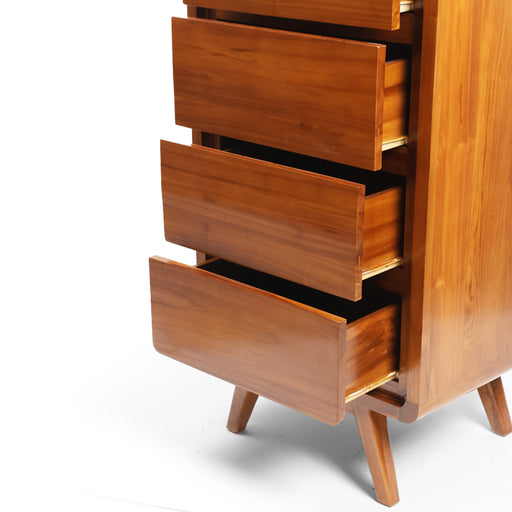 Elevate your organization potential while injecting high-end design into your bedroom layout with the spectacular Aurelia 4-Drawer Tallboy Chest. Embodying the core Urban Oak design philosophy—where timeless mid-century silhouettes seamlessly intertwine with premium natural woodcraft—this vertical storage dresser is a true triumph of artisan carpentry.
By wrapping a high-capacity 4-drawer column in a beautifully rounded, soft-edged frame, it grounds small and large spaces alike with immediate visual warmth and curated designer luxury. In a furniture market saturated with mass-produced, lightweight flat-pack particle board and synthetic plastic veneer composites, the Aurelia stands tall as a genuine legacy piece built for the modern curator.
Why You'll Love It


Premium Solid Teak Craftsmanship: Meticulously handcrafted from 100% genuine solid teak wood, celebrated for its outstanding heavy-duty structural density, natural protective oils, and life-long resilience to provide an exceptionally weighted, wobble-free foundation.

Mid-Century Organic Geometry: Defined by its retro-inspired silhouette with softly rounded outer frame corners. This sleek architectural geometry softens the rigid, harsh lines of standard bedroom walls, introducing a smooth and fluid contemporary movement into your space.

4 High-Capacity Vertical Storage Drawers: Engineered to maximize vertical space while maintaining a highly compact, floor-saving footprint. The four spacious, deep drawers are seamlessly integrated with hidden grasp pulls to keep clothes, linens, and personal accessories effortlessly organized without visual clutter.

Retro Flared Tapered Legs: Showcases an elevated, iconic mid-century base frame with splayed, tapered solid teak legs. This airy bottom architecture lifts the cabinet body off the floor, making small or dense rooms feel significantly lighter, brighter, and more spacious.

Product Specifications



Attribute
Details




Material
100% Authentic Sustainable Solid Teak Wood


Shape
Tall Vertical Rectangle with Rounded Soft Corners and Splayed Legs


Style
Mid-Century Modern / Retro Minimalist / Organic Luxury / Japandi


Finish
Hand-Polished Natural Teak Satin Luster


Drawer Pulls
Minimalist Hidden Hand-Grasp Pulls


Storage Configuration
4 Large Integrated Slide-Out Drawers


Overall Dimensions
120 cm (Height) × 60 cm (Length) × 45 cm (Width/Depth)


Usage
Ideal for Bedrooms, Walk-In Closets, Entryway Organization, and Living Room Storage


