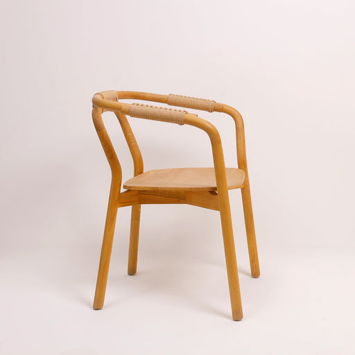 Named after the historic heart of Nordic design, the Bergen Dining Chair is the ultimate expression of modern woodworking. Inspired by the strict principles of functional minimalism, this chair celebrates clean lines, open spaces, and raw material honesty. Its signature architectural V-frame and open curved backrest bring sophisticated simplicity to any styled room.
Why You'll Love It


Architectural V-Frame Geometry: Features a bold, angled base structure that offers superior stability while creating a beautiful sense of negative space underneath the seat.


Genuine Solid Hardwood Composition: Hand-assembled by skilled craftsmen who prioritize structural integrity. Free from cheap veneers or particle boards, it provides a premium, heavy-duty foundation.


Ergonomic Wide Backrest: Designed with a broad, thoughtsfully contoured backrest that follows the natural curve of the spine, ensuring guests remain entirely comfortable throughout long dinner parties.


Product Specifications



Attribute
Details




Material

100% Genuine Solid Teak Hardwood



Style
Scandinavian Minimalist / Mid-Century Modern


Finish
Hand-Polished Natural Wood Grain


Dimensions
Width (Across Armrests): 54 cm | Depth: 48 cm | Seat Height: 45 cm | Overall Height: 78 cm


Usage
Ideal for Contemporary Dining Spaces, Conference Tables, and Living Room Focal Seating


