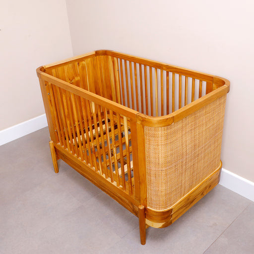 Create a cozy, stylish sanctuary for your little one with our Giggles baby crib. Designed with love and sustainability in mind, this crib blends natural materials with timeless craftsmanship, offering a warm and breathable sleep space. The sturdy wooden frame ensures durability, while the intricately woven rattan panels add a touch of boho-chic charm. Give your baby the gift of comfort and elegance with this unique, artisan-made crib—where nature meets nursery.