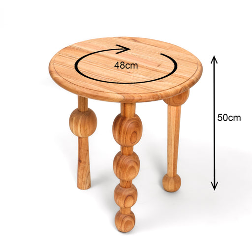 The Paddington Side Table is a conversation starter that brings a sense of joyful geometry to your interior. Defined by its unique "bubble" legs—each meticulously turned to create a series of stacked orbs—this table balances a quirky, sculptural aesthetic with a sturdy tripod foundation. The smooth circular top features a subtle recessed edge, showcasing the natural warmth and beauty of the timber grain.


Sculptural Orb Legs: Precision-turned tripod legs featuring stacked spheres for a bold, playful silhouette.

Recessed Detail: The tabletop features a elegant grooved border, adding a touch of classic refinement to its modern form.

Hand-Finished Luster: Polished to a silky smooth finish that invites touch and highlights the natural wood tones.

Eclectic Statement: A versatile accent piece that works perfectly as a unique nightstand or an eye-catching side table in a lounge.

Specifications:


Diameter: 48cm

Height: 50cm
