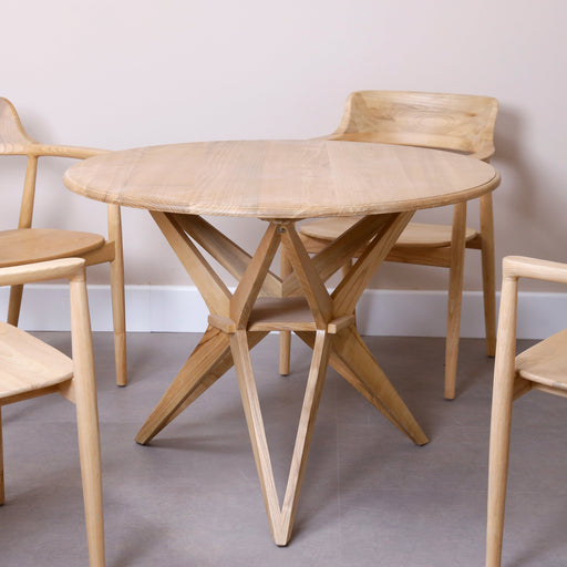 Introducing our Solid Wood Round Table—a centerpiece of classic elegance and enduring style. Crafted with precision from high-quality solid wood, this round table becomes the focal point of your dining area or gathering space. Whether hosting intimate dinners or lively conversations, this table is designed to stand the test of time, bringing warmth and sophistication to your home.Available in two colors, Natural and black.Dimensions - Diameter: 100cmHeight: 75cm
