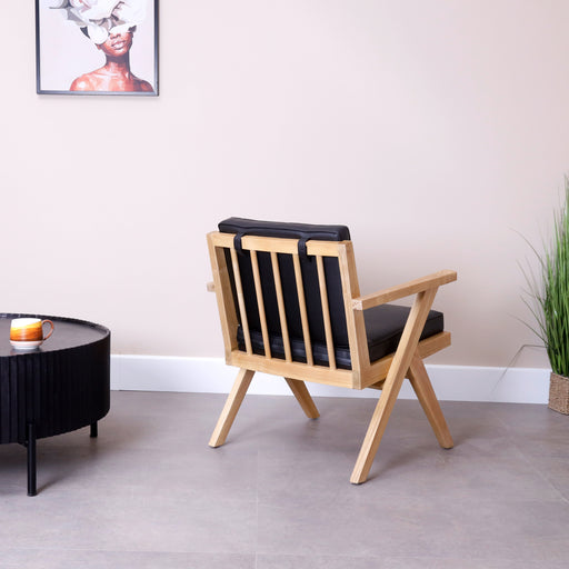 Indulge in the perfect blend of style and comfort with our Solid Wood Lounge Chair. This exquisite piece is crafted with precision from high-quality solid wood, complemented by a plush cushion upholstered in luxurious PU leather. Elevate your relaxation experience with a lounge chair that marries modern aesthetics with unparalleled comfort.Dimensions - Total height: 80cmSeating: 55cm x 50cmHeight floor to seat: 48cm