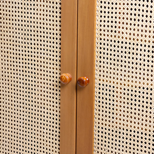 The Odette Shoe Gallery is a masterclass in discreet luxury. From the outside, it appears as a classic boutique cabinet with signature arched rattan-weave doors. However, the interior reveals a spectacular 360-degree rotating carousel, allowing you to organize and access your entire footwear collection with a simple turn. It’s the perfect blend of high-concept engineering and organic, tropical elegance.


360° Rotating Carousel: An integrated multi-tier revolving system that maximizes storage depth while ensuring every pair is easily accessible.

Arched Rattan Artistry: Hand-inlaid rattan panels set within elegant arched frames provide natural ventilation, keeping your collection fresh and beautifully displayed.

Space-Saving Sophistication: Its rectangular exterior footprint belies the massive internal storage capacity, making it a dream for walk-in robes or narrow foyers.

Bespoke Craftsmanship: Features hand-turned timber knobs and a smooth-action rotation mechanism designed for daily use and longevity.
