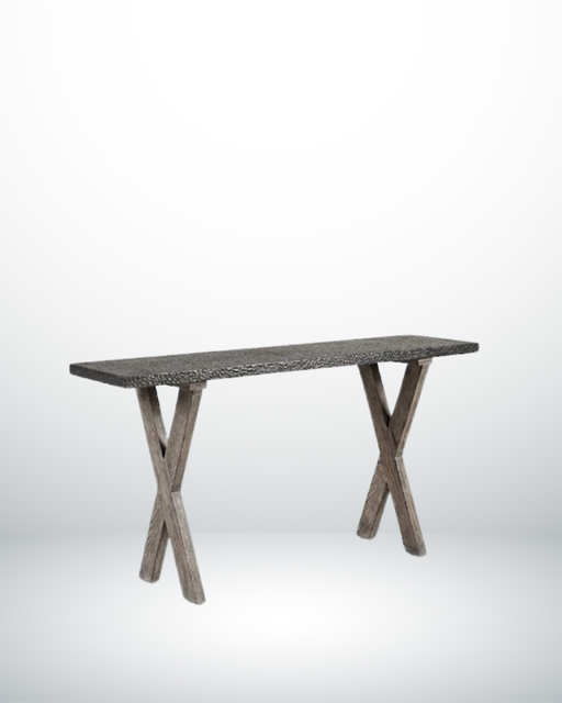 Bring dramatic texture and a narrow, space-saving silhouette to your hallways, entryways, or living areas with The Uluwatu High Table. Perfectly balanced at an elevated 94 cm height, this multi-functional console style table features a rugged, deeply textured dark charcoal grey stone-look top set against beautifully weathered X-frame timber legs.
Its ultra-slim 30 cm depth makes it an ideal choice for tighter architectural walkways, behind floating sofas, or acting as an elegant accent display bar. The contrast between the rough, hammered textural surface of the top and the rustic organic charm of the crisscrossed wooden legs provides a gorgeous, grounded aesthetic suited for coastal, modern rustic, or brutalist interior design themes.


Ultra-Slim Space-Saving Depth: At just 30 cm wide, it maximizes display space in narrow corridors or entry halls without impeding foot traffic.


Textured Statement Surface: Features a beautifully tactile, dark chiseled composite stone surface that adds instant depth and visual drama.


Architectural X-Leg Base: Supported by a robust, weathered timber X-frame trestle base providing exceptional structural stability and rustic flair.


3. Dimensions


Length: 120 cm


Width (Depth): 30 cm


Height: 94 cm


4. Material


Tabletop: Premium Textured Stone Composite / Terrazzo Finish (Charcoal Black)


Base Leg Structure: Solid Weathered Hardwood (Driftwood Tint Matte Finish)

