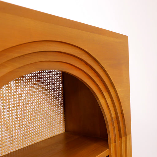 Elevate your interior styling with the Vento Cabinet. Embodying the Urban Oak commitment to where rugged materials meet refined design, this handcrafted bookcase is a masterclass in organic luxury.
By combining the structural power of solid teak wood with the delicate, breathable weave of a natural rattan back panel, the Vento anchors your living space with warmth and a sophisticated artisan soul. In a world of mass-produced, synthetic veneer furniture, its authentic solid wood construction and arched molding add a layer of timeless elegance—making it an absolute favorite for those seeking a "quiet luxury" aesthetic.
Why You'll Love It


Iconic Arched Design: Features a breathtaking arched interior frame inspired by classical Mediterranean architecture. This soft, curved silhouette provides a sophisticated, artistic contrast to the sharp lines of modern apartments.

Premium Solid Teak Wood: Meticulously handcrafted from 100% genuine solid teak. Renowned for its incredible longevity and rich natural oils, this heavy-duty frame ensures your cabinet remains a stable, durable legacy piece for years to come.

Natural Rattan Backing: Features a stunning back panel hand-woven from authentic natural rattan. This organic texture adds "visual lightness" and airy depth, creating a beautiful high-contrast backdrop for your literature and decor.

Curated Gallery Display: Designed with a slim footprint but substantial presence, its open architectural tiers turn everyday storage into a beautifully balanced showcase for books, art pieces, and family heirlooms.

Product Specifications



Attribute
Details




Material
100% High-Quality Solid Teak Wood &amp; Natural Rattan


Style
Modern Mediterranean / Arched Minimalist / Coastal Luxury


Finish
Hand-Polished Natural Teak Grain


Configuration
4-Tier Open Display Shelves


Overall Dimensions
170 cm (Height) × 94 cm (Width) × 34 cm (Depth)


Usage
Ideal for Living Rooms, Home Offices, Libraries, and Dining Areas




Note: Because each Vento bookcase is individually handcrafted from genuine solid timber and natural fibers, unique variations in the organic grain lines, wood shading, and rattan weave are natural markings of its unique artisan origin.

